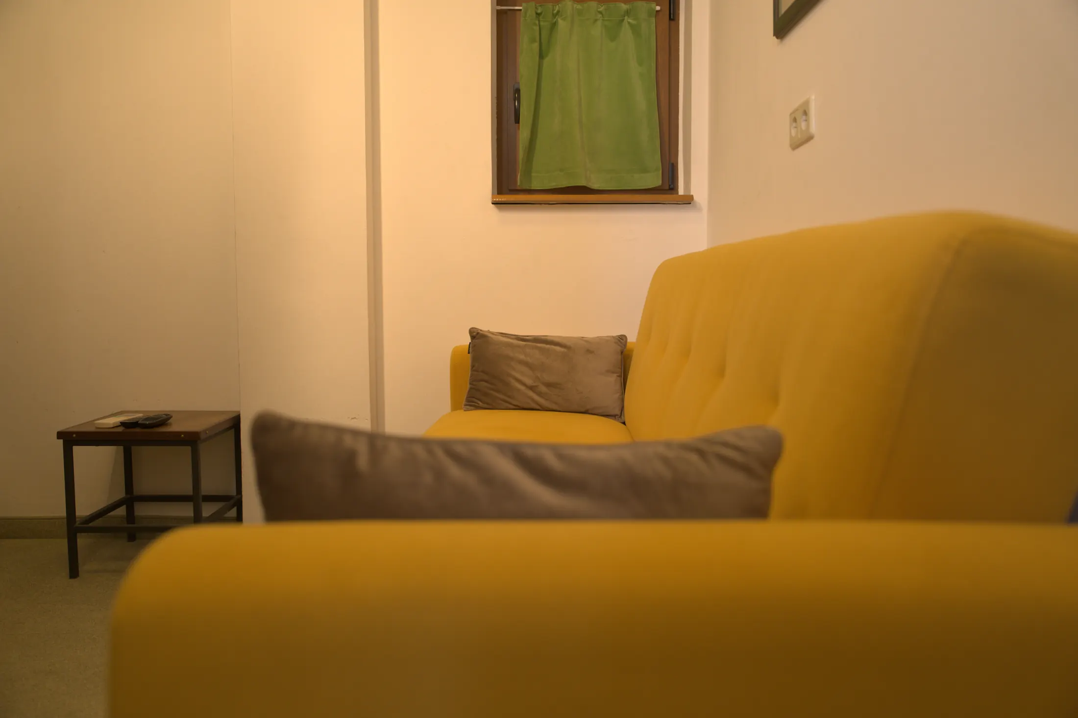 The seating corner with a yellow sofa by the window, Hotel Villa Diana, Lučac, Split