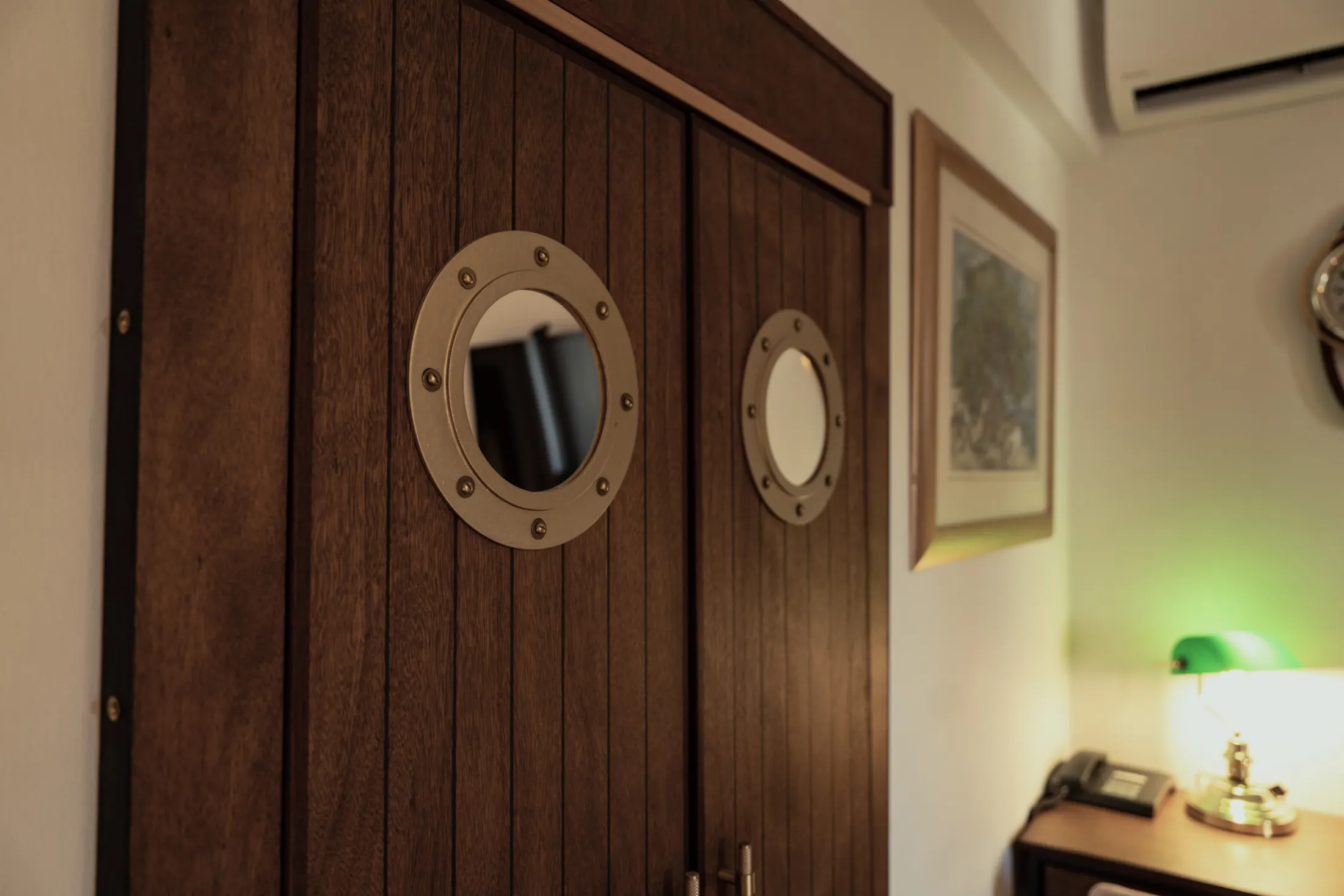 The wooden wardrobe with porthole windows, and the air conditioning, Hotel Villa Diana, Lučac, Split