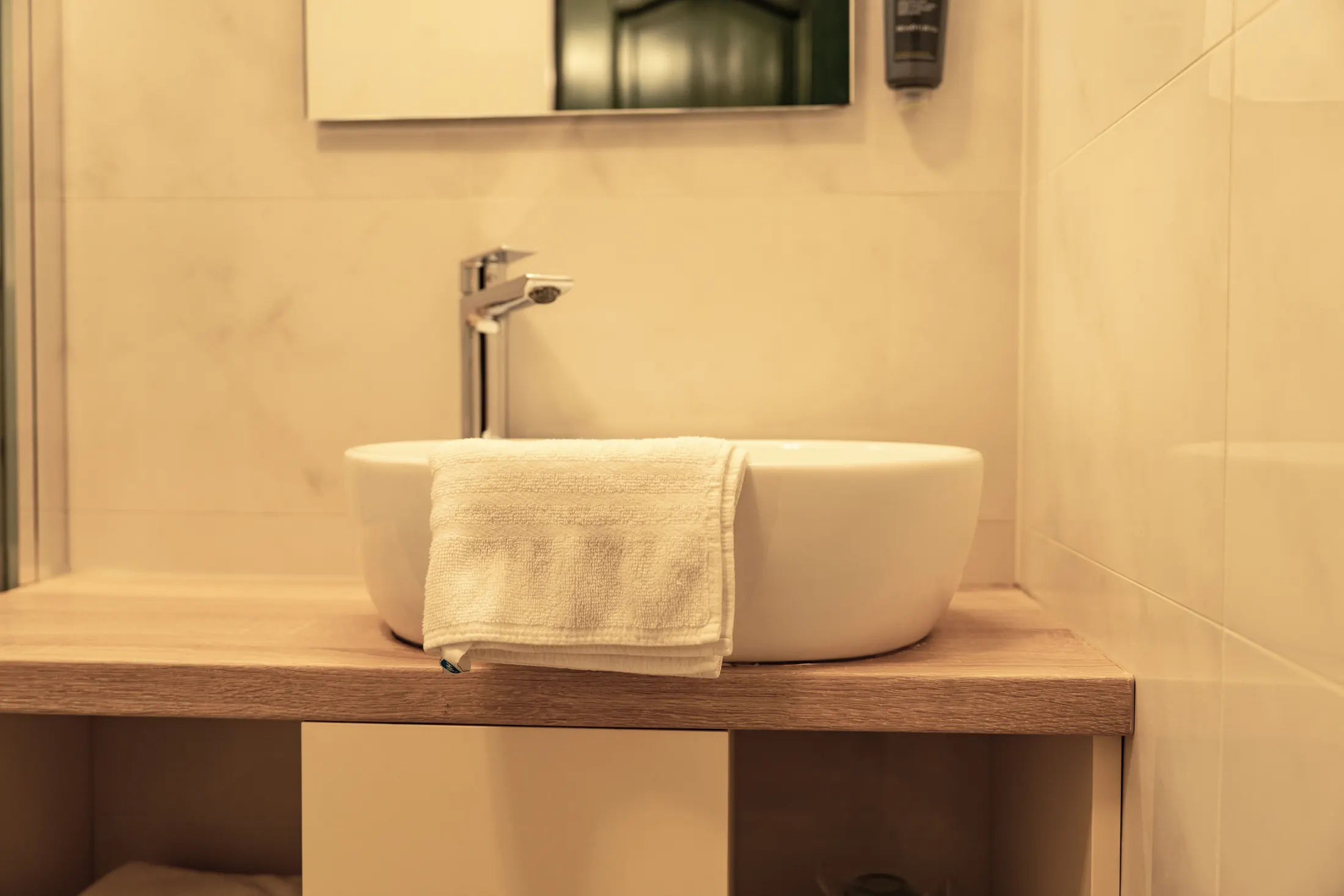 The washbasin on a wooden top in the bathroom, Hotel Villa Diana, Lučac, Split