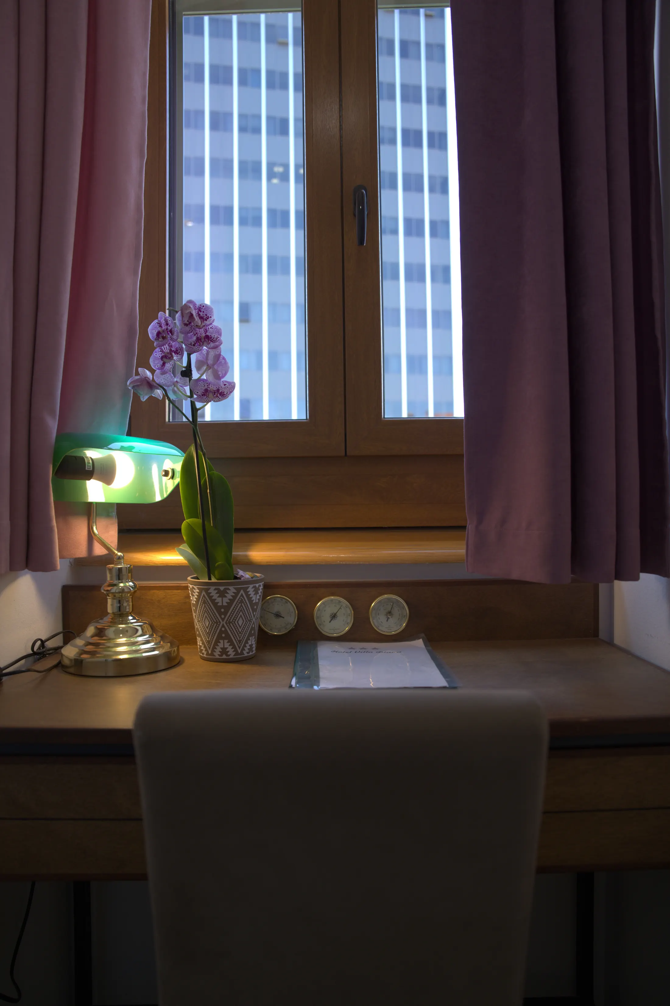 The desk by the window, with a green lamp, an orchid and a barometer, Hotel Villa Diana, Lučac, Split