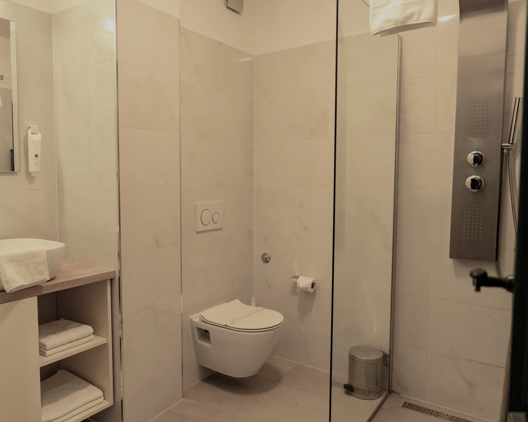 The private bathroom with a shower column behind a glass screen, Hotel Villa Diana, Lučac, Split